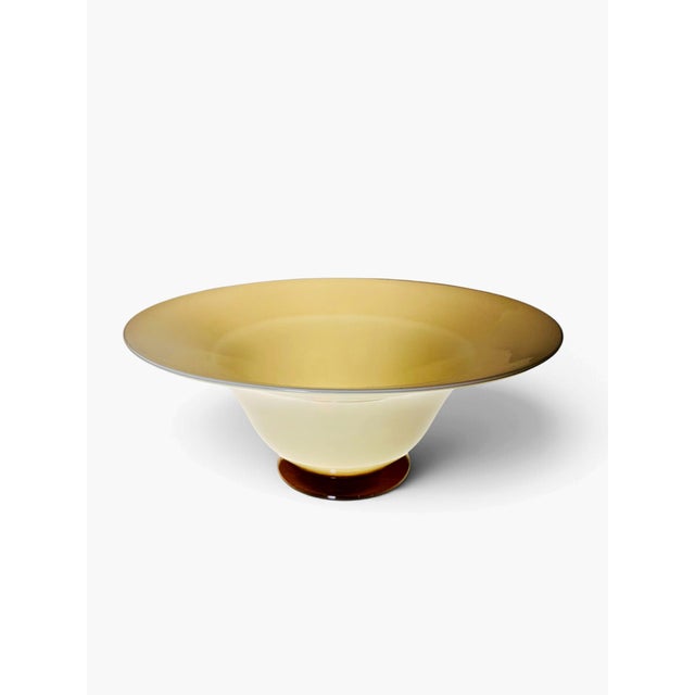 Large beautiful centrepiece from the “Anni Trenta” series by Venini. Yellow lattimo Murano Glass on an amber base. Etched...