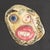 A 1970s ceramic tile by the American artist Mark Bulwinkle (born 1946). This ceramic piece depicts an abstract face with...