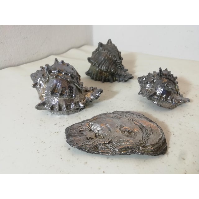 Set of four silver-plated shells by Federico Buccellati. Authentic Italian high-quality jewelry. Very realistic in detail....