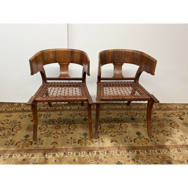 Design Plus Gallery presents a Pair of Klismos Chairs. These lizard-wrapped klismos chairs are luxurious, modern-...