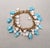 Vintage Napier Book Piece Goldtone Blue & Turquoise Art Glass Charm Bracelet, 1967 For Sale - Image 12 of 15