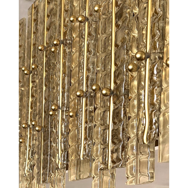 Contemporary gold chandelier in Murano Glass full of leaves that give a touch of “tropical” design. Extremally elegant and...