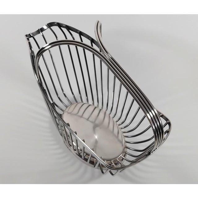 Elegant wine bottle holder by the prestigious French silversmith Christofle, from their renowned Gallia line, designed by...
