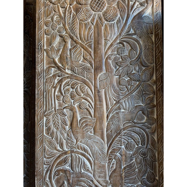 Celebrate the timeless symbolism of growth, strength, and connection with this vintage hand-carved Tree of Life barn door....