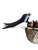 Austrian folk art. Wood carved swallows with babies in nest.