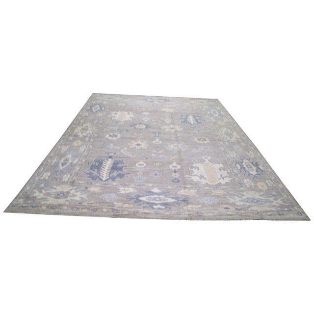 Hand-knotted with care using traditional rug making techniques, this wool rug blends timeless craftsmanship with a modern...