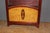 Small Art Deco period display cabinet in mahogany and burr wood, it opens with a door, marquetry on the door depicting a...