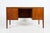 This minimalistic design mahogany veneer desk was produced in 1950’s, Denmark. It features various drawers, brass...