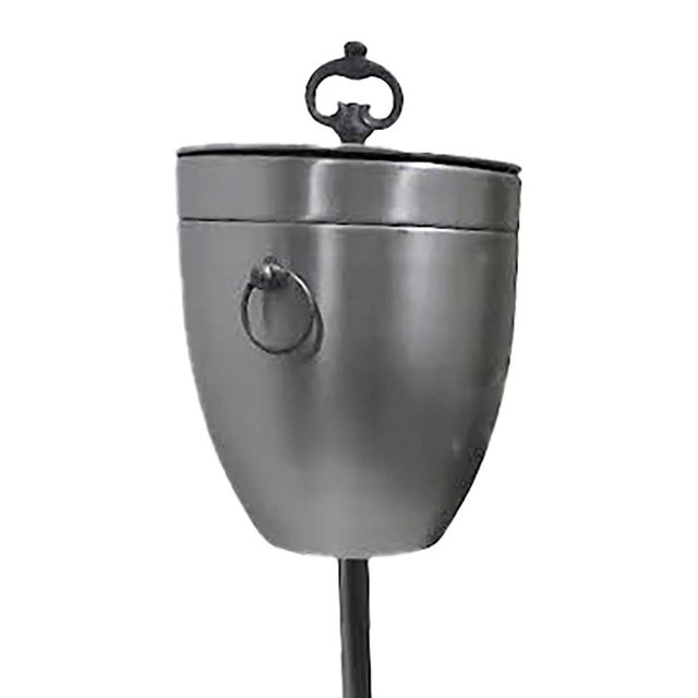 Elevate your home bar or next gathering with this exceptional unsigned Mid-Century Modern floor-standing champagne bucket....