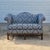 This is an elegant vintage camelback settee with newer upholstery in blue damask with nailhead trim. The loveseat is...