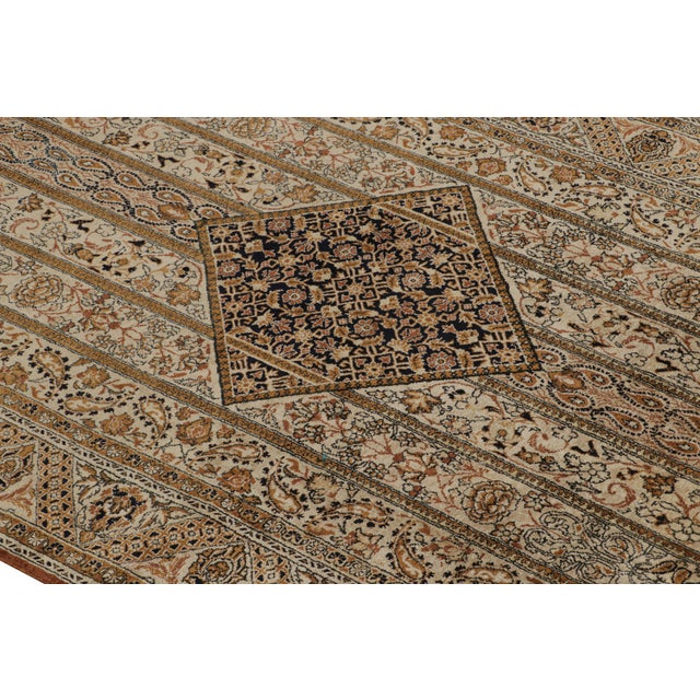 Originating From Persia In 1890, This Antique Hand Knotted Wool Persian Rug Hosts A Qum Design Marrying An Uncommon...