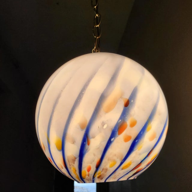 These vintage blue swirled pendants are hand blown and truly statement pieces. With specs of color around tbe bottom, they...