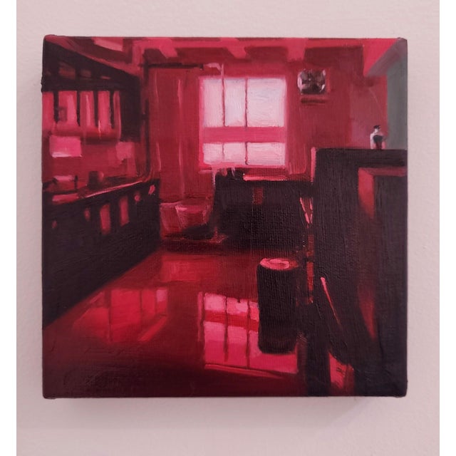 This oil painting immerses the viewer in a monochromatic red interior, evoking a sense of warmth and intimacy. The play of...