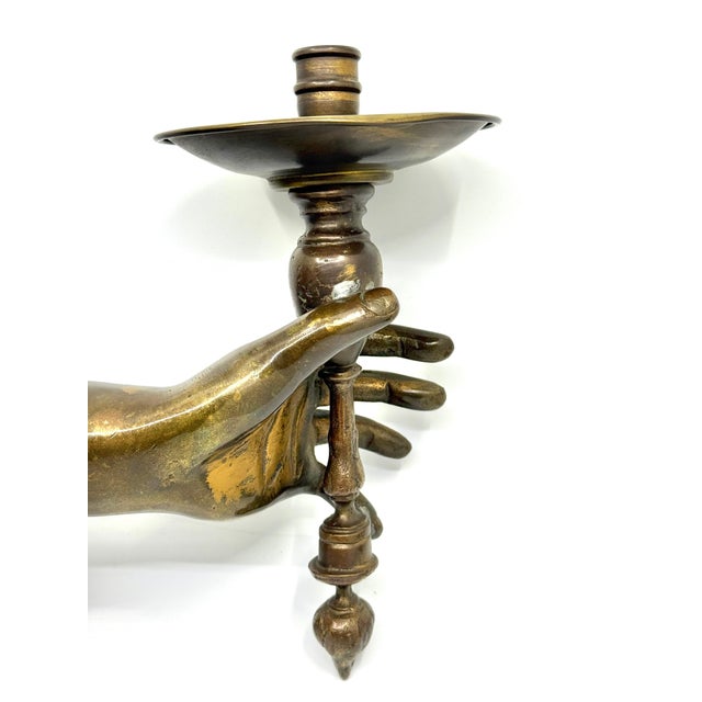 A nice French Art Deco candle wall sconce with a hand holding the candle holder. It is styled after a famous Andre Arbus...