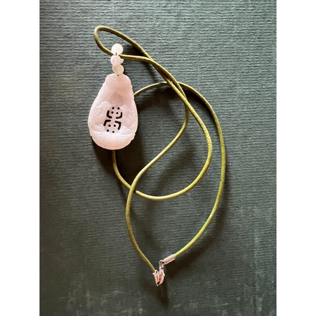 Asian Hand-Carved Jade Pendant Necklace From a Highly Translucent Jadeite Stone With Traditional Asian Auspicious Symbols to Bring Good Fortune For Sale - Image 3 of 3