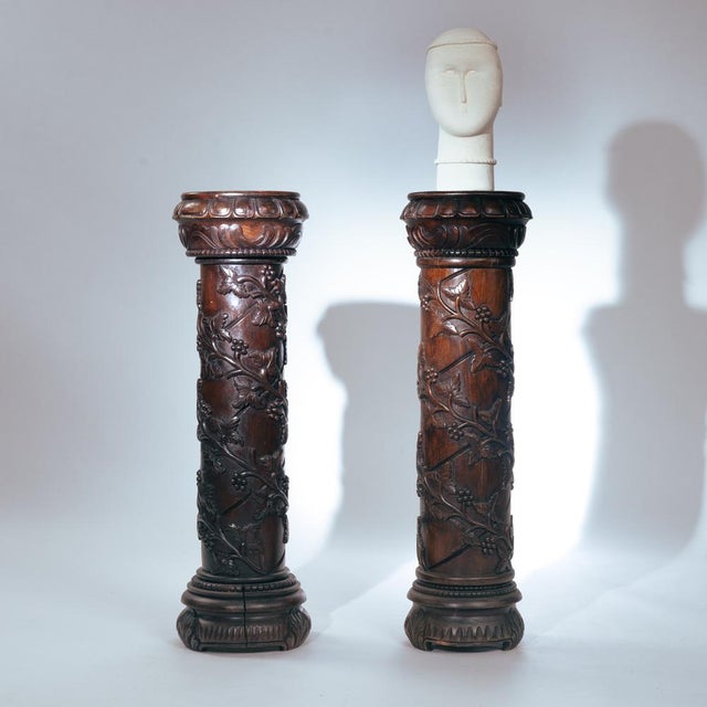 2 wooden pedestals column with Hand-Carved Grapevine Motif, France 1920s These are a classic pair of torchère/plant stand...
