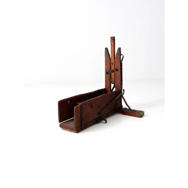 Antique wood bender featuring a primitive wood and iron frame. Once a functional woodworking tool, it now serves as a...
