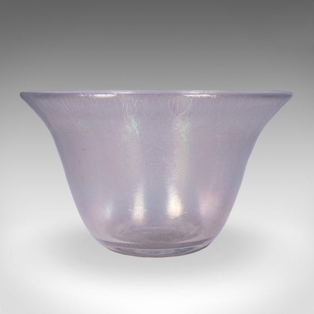 This is a vintage lustre fruit bowl. A Continental, art glass display dish in the manner of Steuben Verre De Soie, dating...