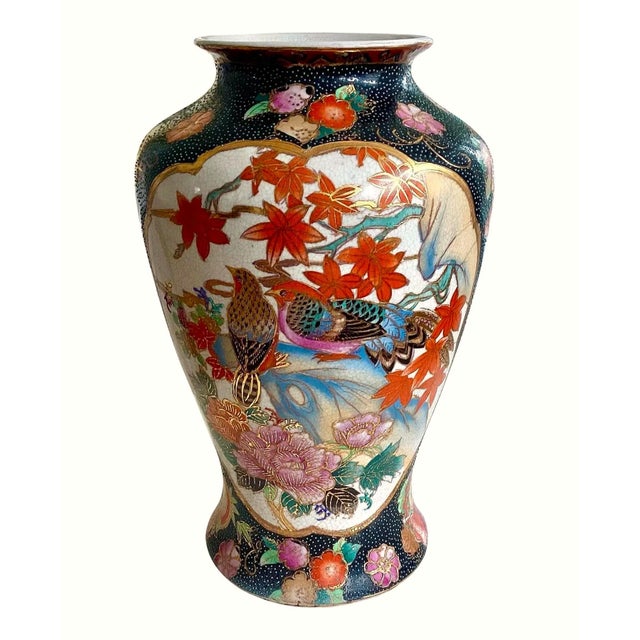 Vintage hand-painted porcelain vase, with an intricate design of birds, flowers and gold accents. "baluster" shape with a...