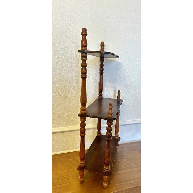 Classic vintage wooden étagère featuring an elegant tiered open-shelf design, perfect for displaying books, collectibles,...