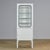 Vintage medicine cabinet from the 1970s, produced in Hungary. This cabinet is made of iron and glass, with the glass held...