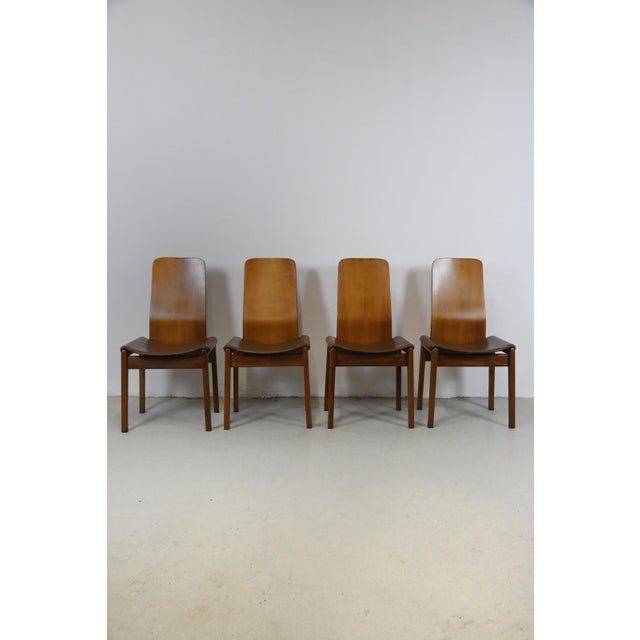 Beautiful set of four Fiorenza chairs, designed by Tito Agnoli and produced by the Italian company Molteni. Walnut frame,...