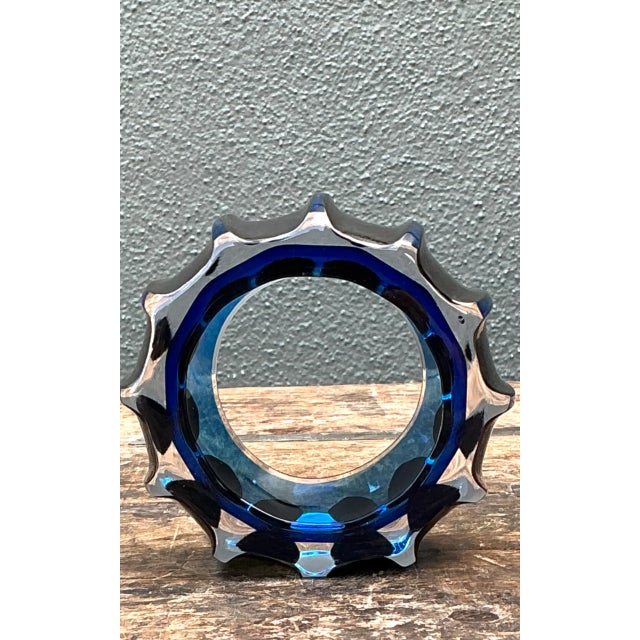 This vintage blue sculptural art glass piece takes the shape of a gear, pairing an industrial silhouette with a...