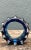 This vintage blue sculptural art glass piece takes the shape of a gear, pairing an industrial silhouette with a...