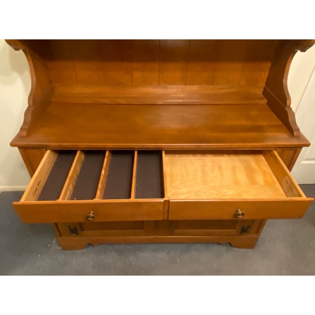 This beautiful Mid-Century Nutmeg Buffet and Hutch by Ethan Allen is in excellent condition. The maple piece was well-...