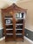 Add timeless sophistication to your home with this stunning French Provincial-style curio cabinet / display hutch. Crafted...