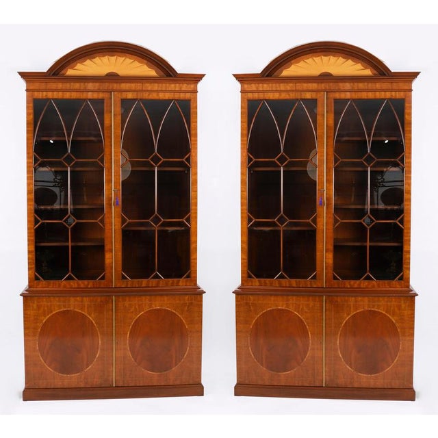 This is a superb and decorative vintage pair of Georgian revival flame mahogany bookcases, purchased from Harrods, London,...