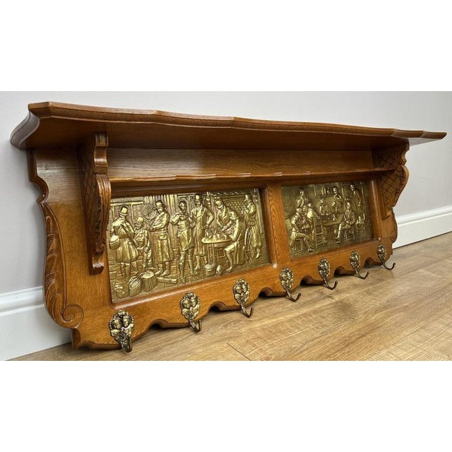 An exceptional Vintage French coat hanger, beautifully crafted and richly detailed with striking decorative brass panels...