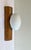 Mid Century wall lamp of pine wood and white glass Temde Leuchten 1970. In very good condition with beautifully visible...