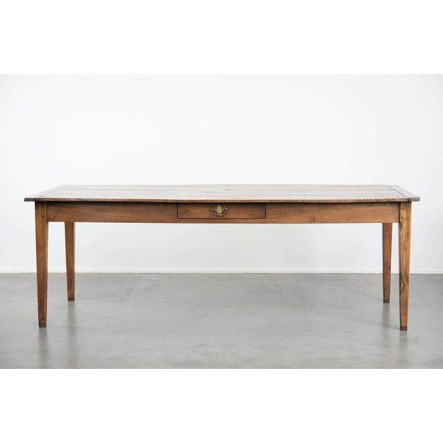 Beautiful antique French oak farmhouse dining table for 6 to 8 people with three drawers and a timeless look. : This...