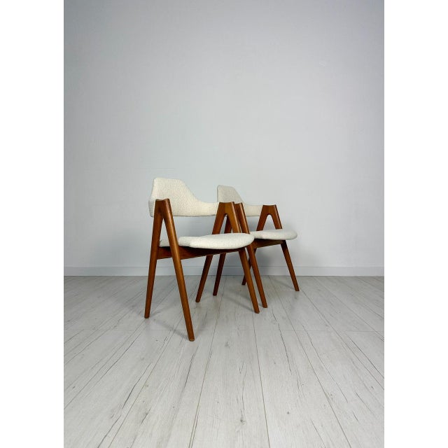Beautiful set of 2 vintage Kai Kristiansen ‘Compass‘ Dining Chairs from the 1950s. High-quality solid teak frame with a...