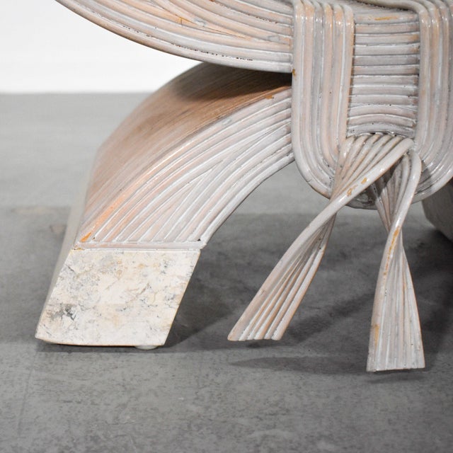 A cerused pencil reed reed and tessellated stone coffee table in an elegant curule form with ribbon detailing. Attributed...