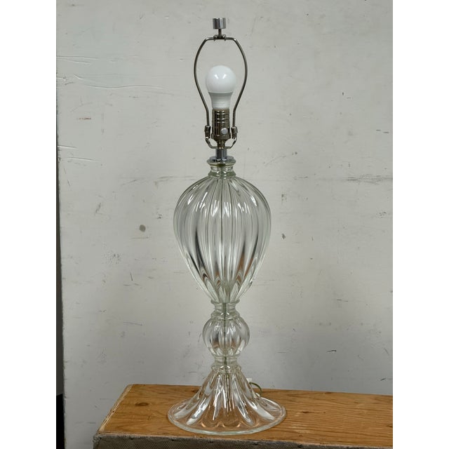 Design Plus Gallery presents a Murano Glass Table Lamp from Bella Figura Lighting. The table lamp is made from hand blown...