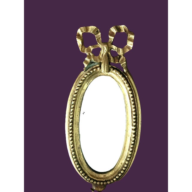 An exceptional pair of french louis xvi style gilt bronze mirrored wall sconces by maison lucien gau, paris, model 16572,...
