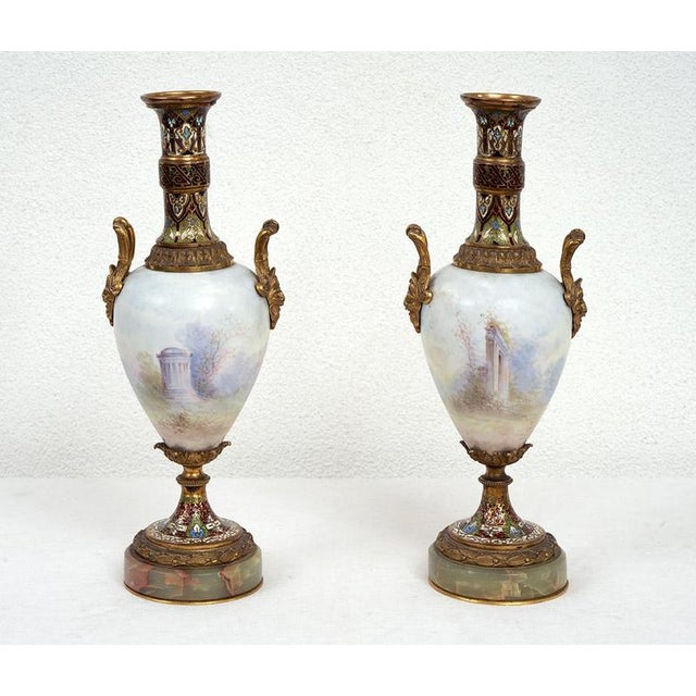 Pair of antique Napoleon III vases in polychrome Sevres porcelain and cloisonné. The central porcelain body depicts a...