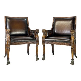 Pair of Theodore Alexander Regency Style Carved Lion & Hairy Paw Caster Armchairs in Brown Leather For Sale