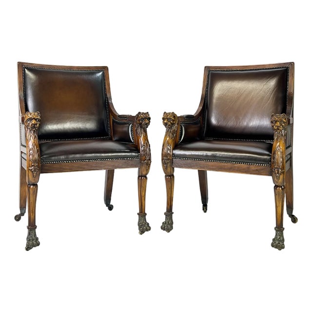Pair of Theodore Alexander Regency Style Carved Lion & Hairy Paw Caster Armchairs in Brown Leather For Sale