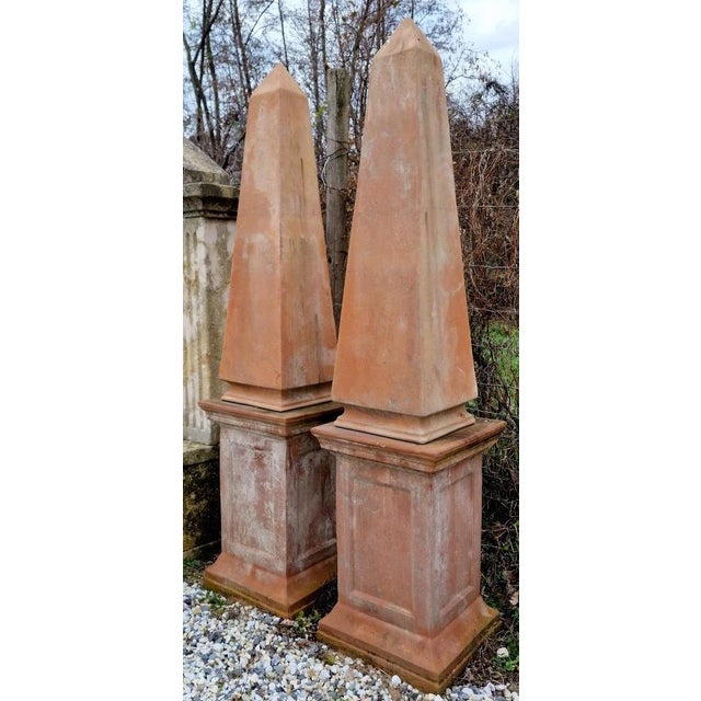 Pair of terracotta pyramids with base, early 20th century obelisk with terracotta garden or interior with base. Maximum...