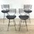 Bold, sculptural, and unmistakably stylish, this set of four swivel bar stools attributed to Arthur Umanoff for Howard...