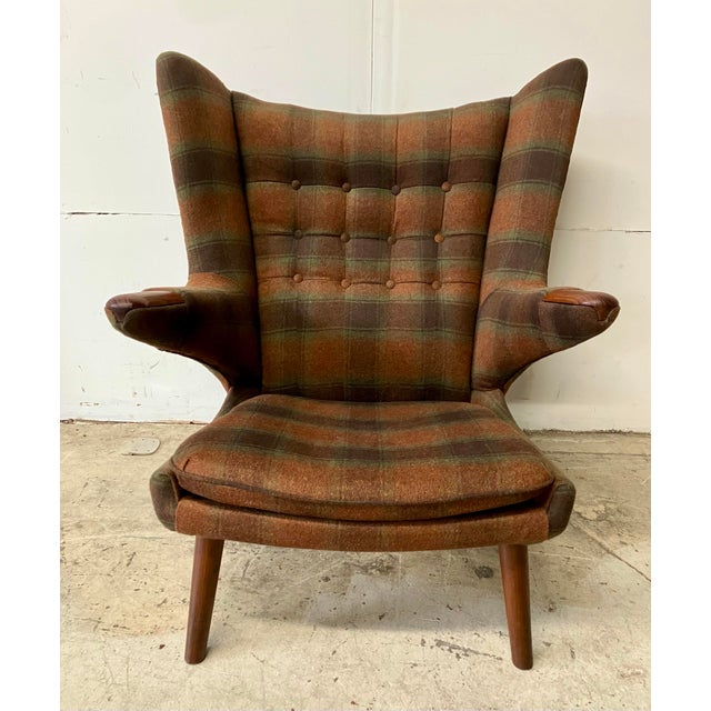 Wegner’s iconic and revered teak wood frame newly covered in a wool tartan upholstery. This particular model was...