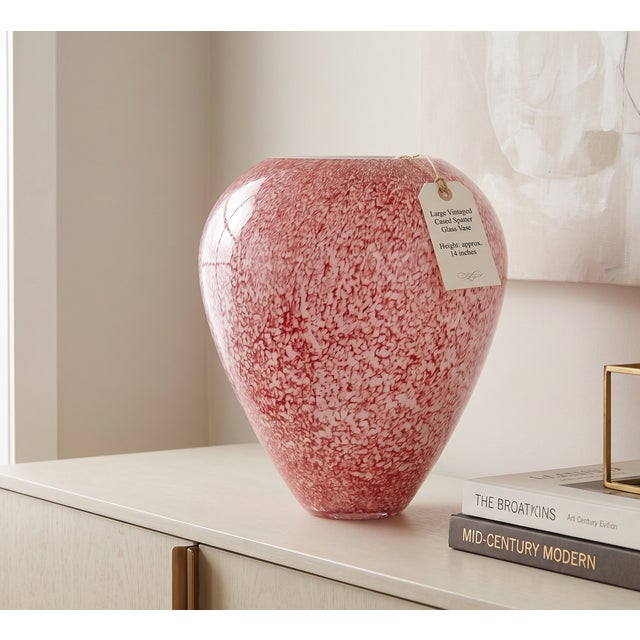 A rare and impressive scale mid-century art glass vessel featuring a vibrant pink and white "spatter" or "confetti" motif....