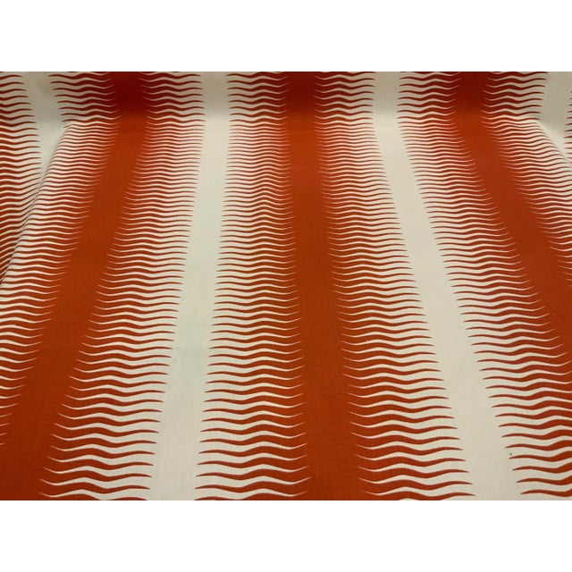 This modern designer fabric has a persimmon and white wave design. It is woven and has a soft hand and is multipurpose....
