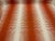 This modern designer fabric has a persimmon and white wave design. It is woven and has a soft hand and is multipurpose....