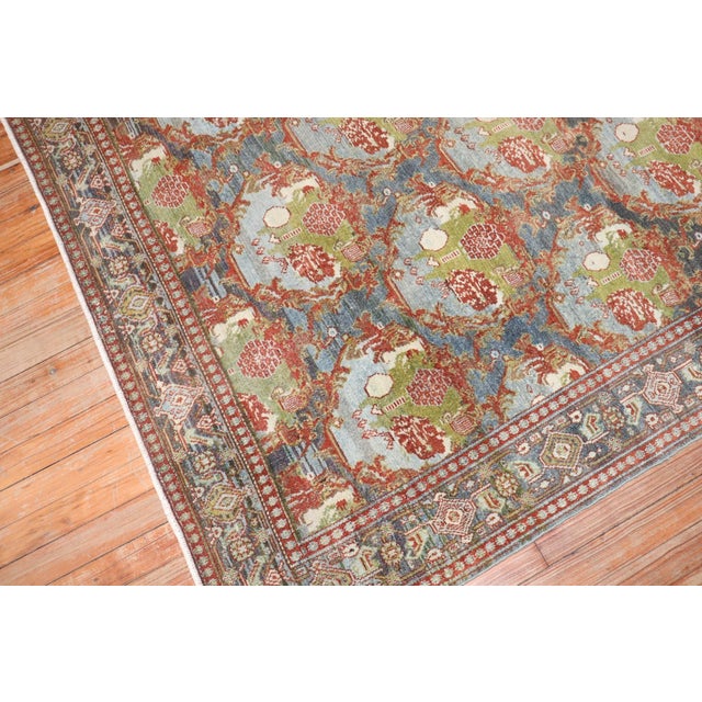 An accent size Persian Senneh Rug with a gol farang design