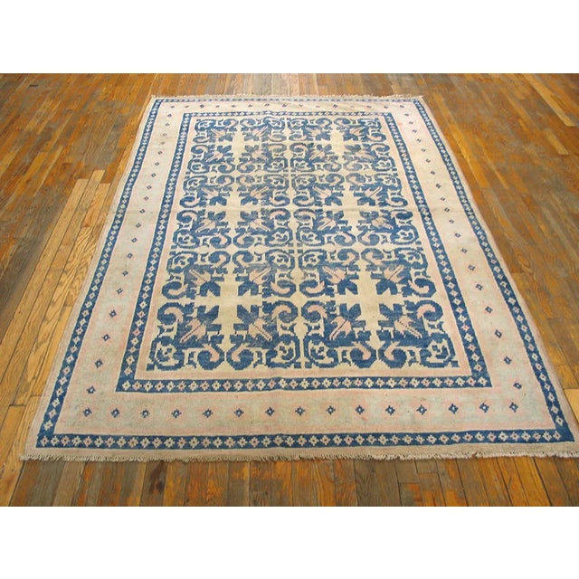 Antique Indian Agra Cotton Rug with a navy background and beige border. Agra - Cotton A subtype of Agra production in...