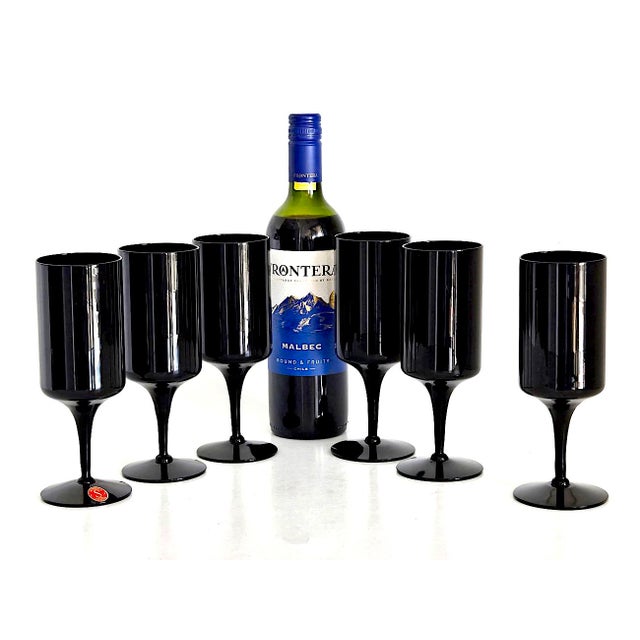 Offered is a sleek and chic set of hand blown black glass water goblets made by Seneca Glass in the 1970s. These are the...